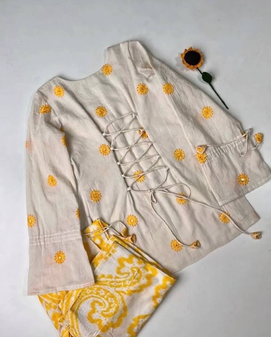 Radiant Ivory White Short Kurti Adorned with Sunshine Yellow Embroidery Paired with a Flowy Patterned Farshi Salwar